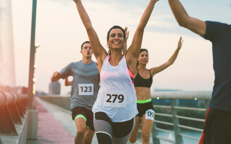 people running on a bridge